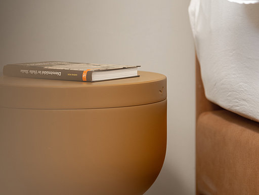 Modern bedside table next to the bed in the Avista Acqua apartment